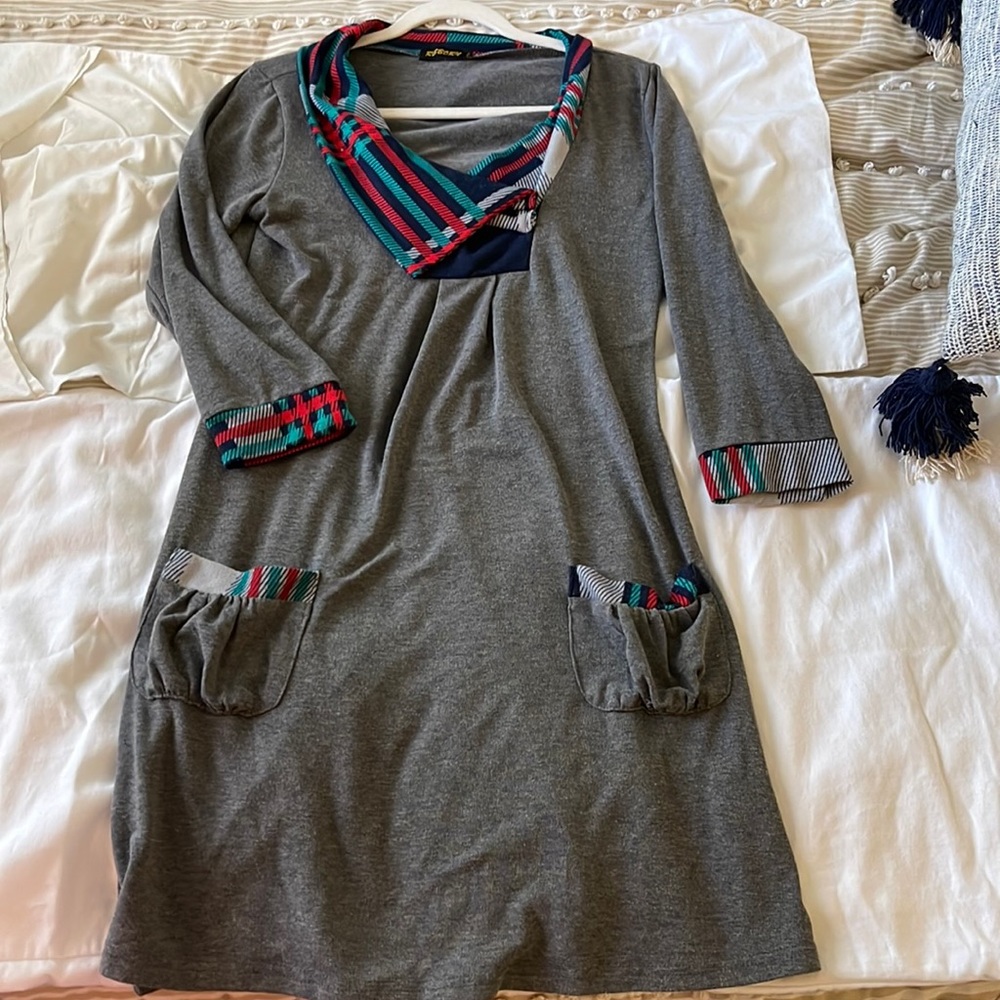 Cozy winter dress with long sleeves and styled pockets